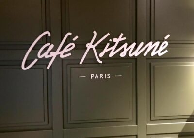 Acrylic lettering on wood panelling